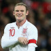 Wayne Rooney adjusts his England captain's armband