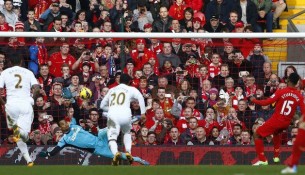 Liverpool's Sturridge scores a penalty past Swansea City's Vorm during their English Premier League soccer match at Anfield in Liverpool