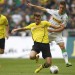 Borussia-Dortmund-s-Durm-is-challenged-by-Borussia-Moenchengladbach-s-Herrmann-during-Bundesliga-soccer-match-in-Moenchengladbach